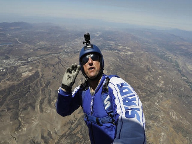 He's a skydiver working with a net, but no parachute