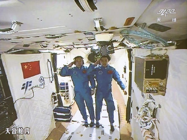Chinese astronauts enter space station after docking