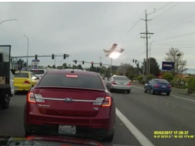 Fiery plane crash at busy intersection caught on dashcam video
