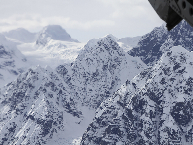 Fallen climber chipped from ice by rescuers on Alaska mountain