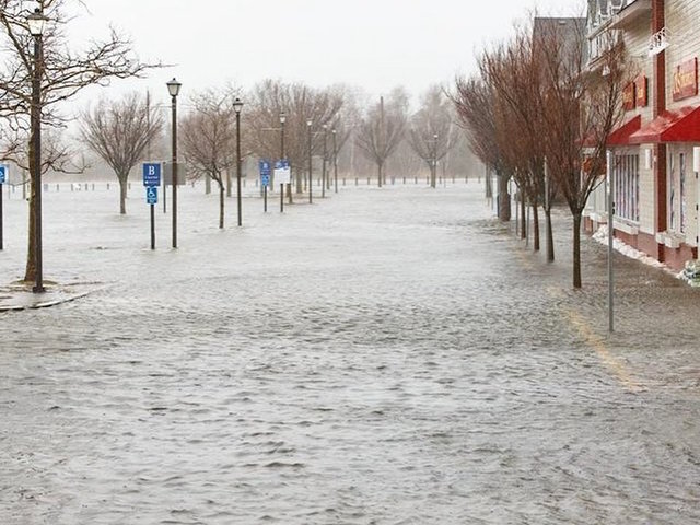 Battered Northeast tries to dig out: 'The beach is all over the front yard'