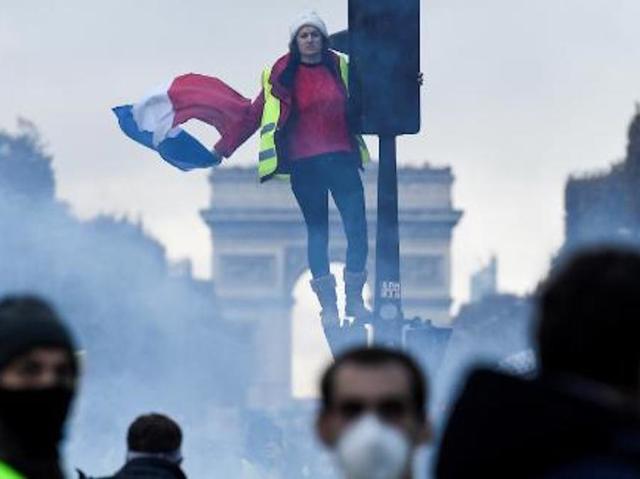 Police fire tear gas, water cannon at Paris fuel protesters